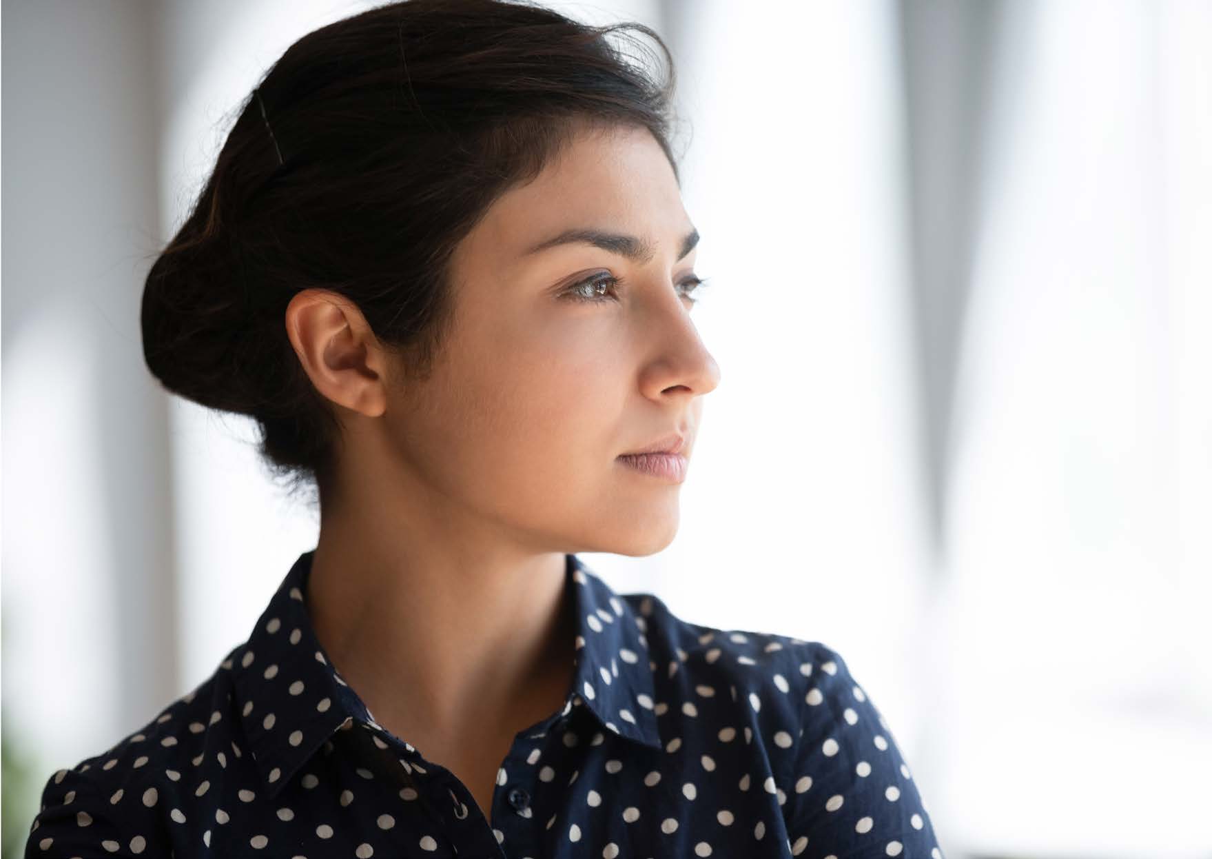 Young woman in a polka dot shirt